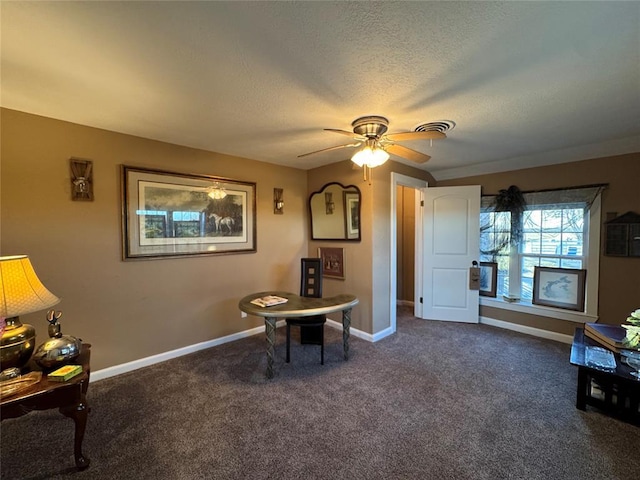 interior space with ceiling fan and a textured ceiling