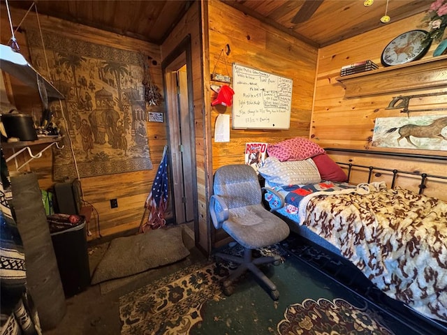 bedroom featuring wooden ceiling and wood walls