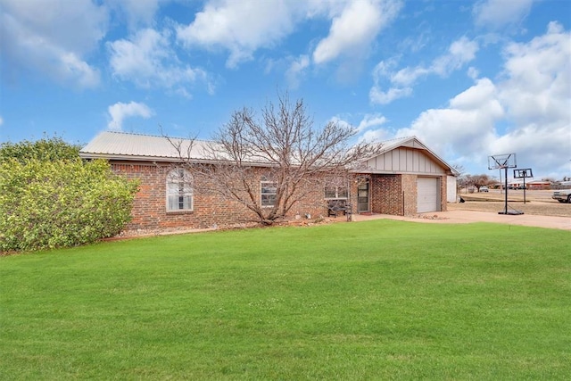 view of front of property with a garage and a front lawn