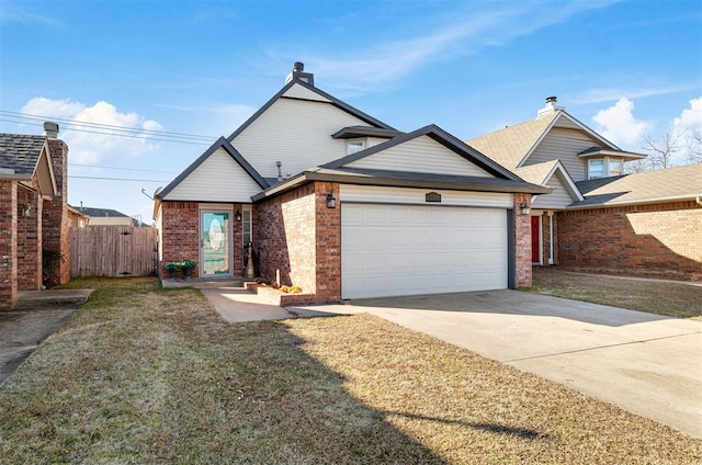 view of front of property with a garage and a front lawn