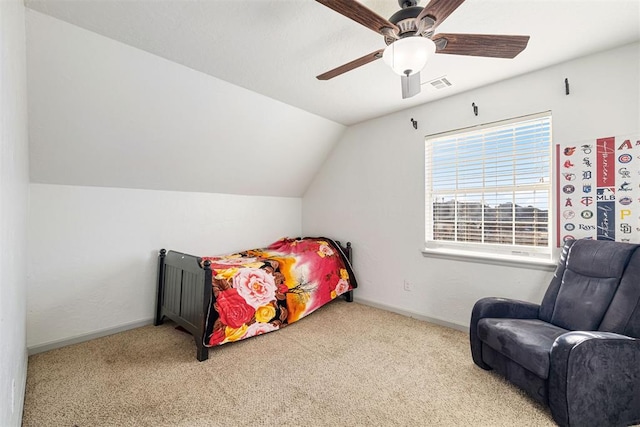 carpeted bedroom featuring ceiling fan and vaulted ceiling