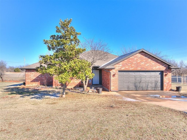 single story home with a garage and a front yard