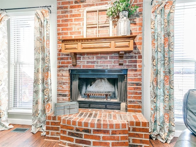 room details featuring wood-type flooring and a fireplace