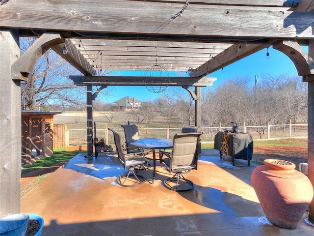 view of patio with a grill and a pergola