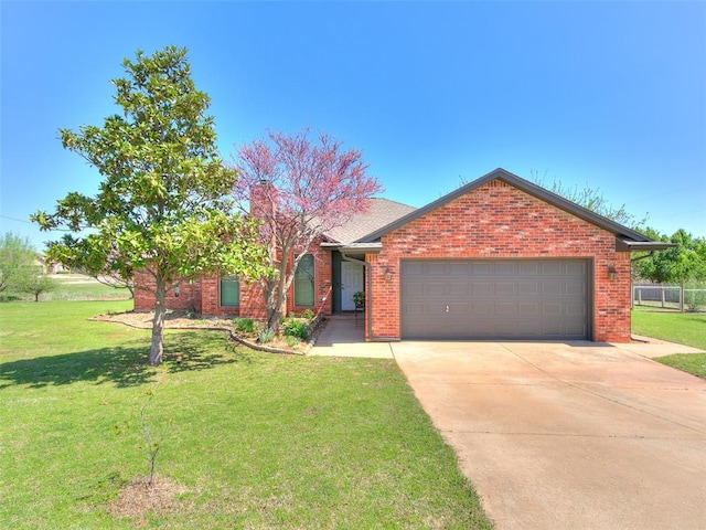 ranch-style house with a garage, concrete driveway, brick siding, and a front lawn