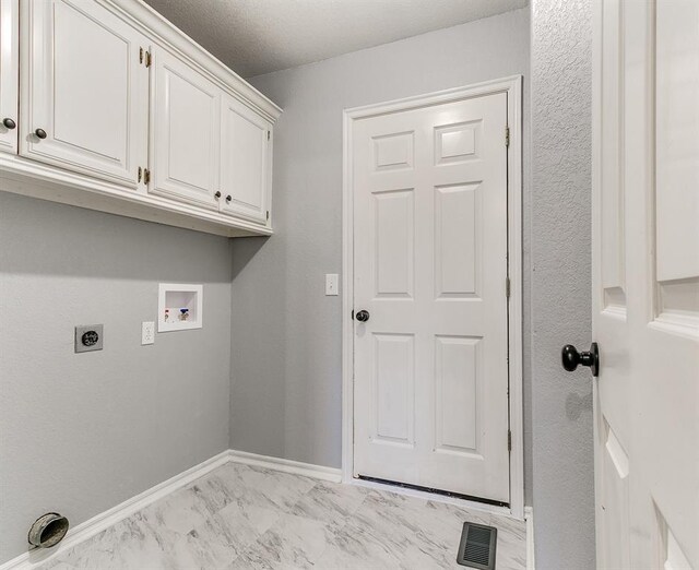 laundry room with visible vents, baseboards, washer hookup, cabinet space, and electric dryer hookup