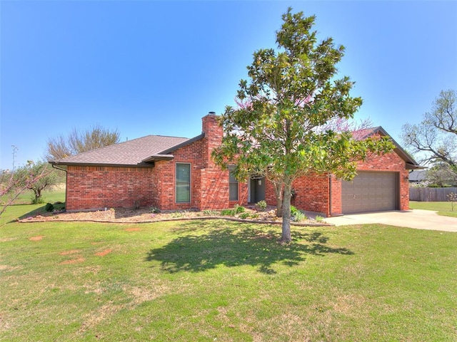 view of front facade featuring an attached garage, concrete driveway, a front lawn, and brick siding
