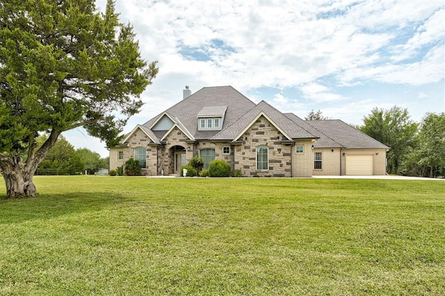 craftsman-style home with a garage and a front lawn