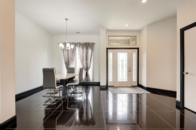 dining room featuring a notable chandelier