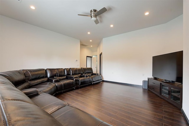 living room featuring ceiling fan and dark hardwood / wood-style flooring