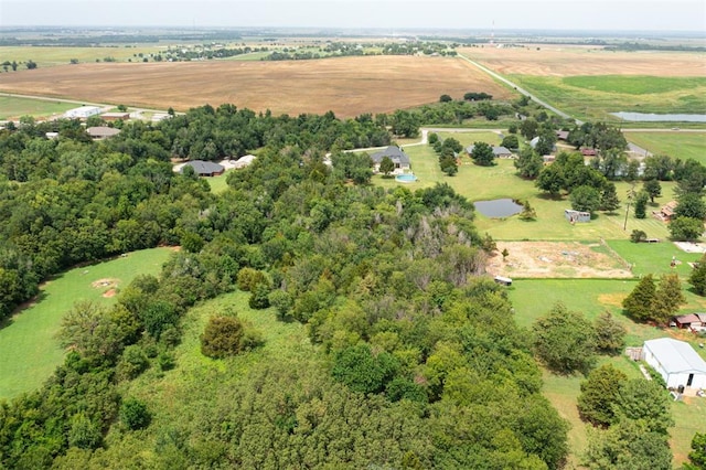 birds eye view of property with a rural view and a water view