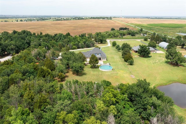 birds eye view of property with a water view and a rural view