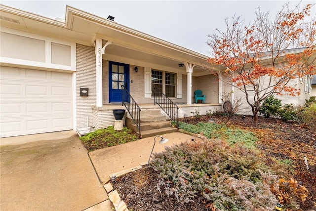 property entrance featuring a garage and covered porch