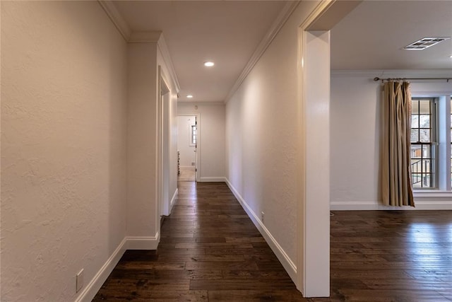 hallway with crown molding and dark hardwood / wood-style flooring