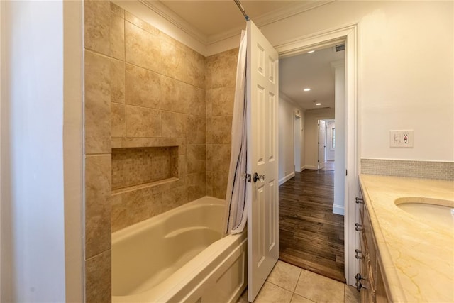 bathroom featuring shower / tub combo with curtain, vanity, tile patterned flooring, and ornamental molding