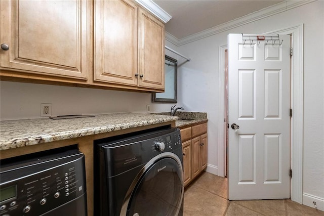 washroom with sink, cabinets, ornamental molding, light tile patterned flooring, and separate washer and dryer