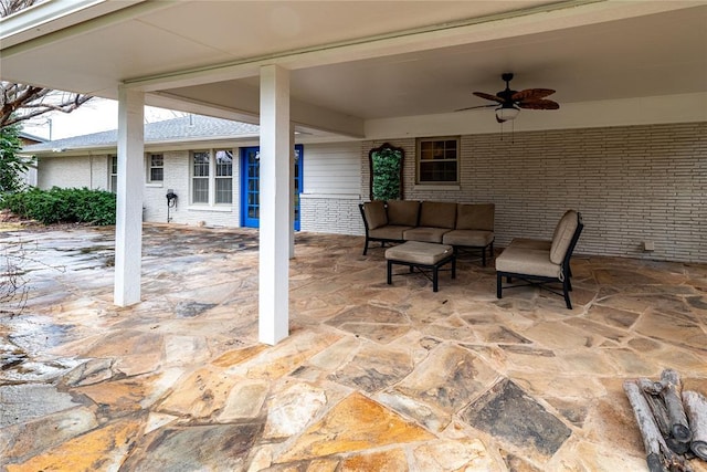 view of patio featuring ceiling fan