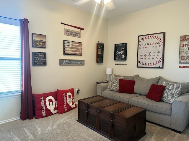 living room featuring carpet floors and a ceiling fan