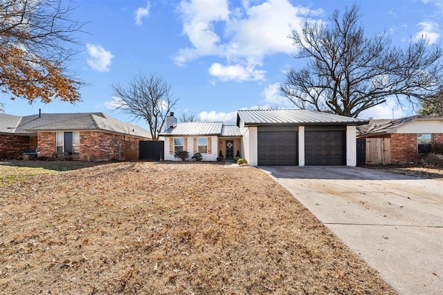 ranch-style home featuring a garage