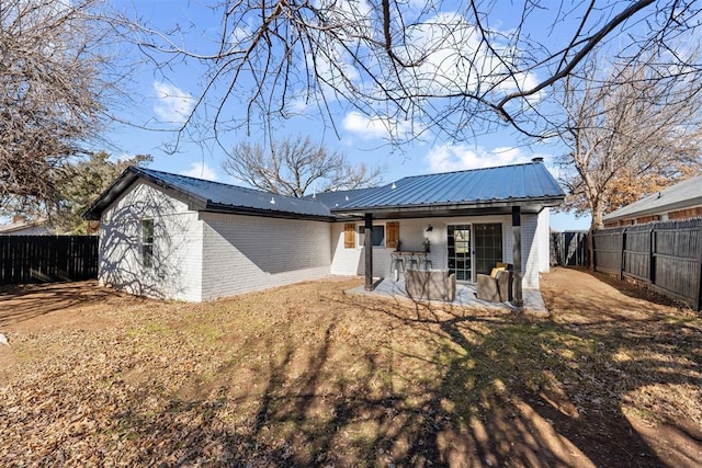 back of house featuring a patio area