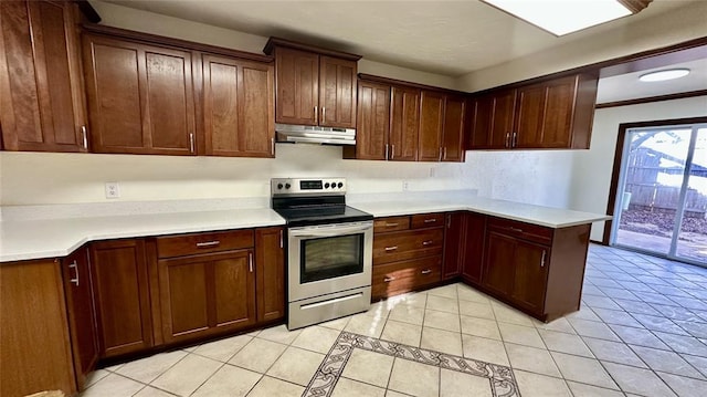 kitchen featuring stainless steel range with electric stovetop and light tile patterned floors