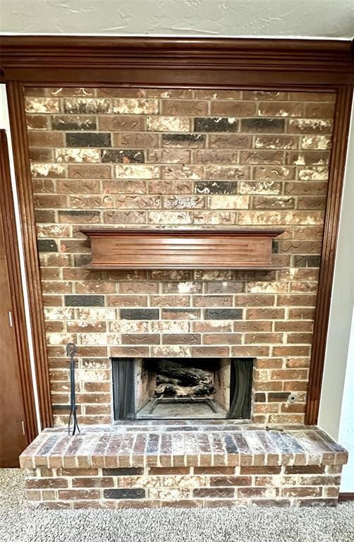 details with carpet flooring and a fireplace