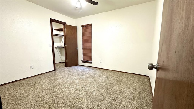 empty room with ceiling fan and carpet flooring