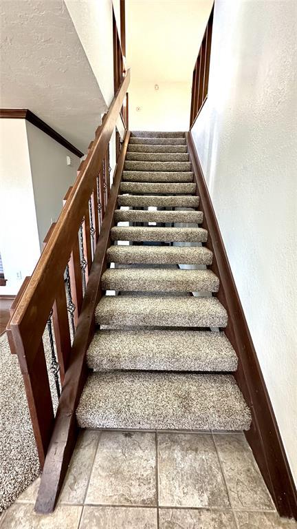 staircase with ornamental molding