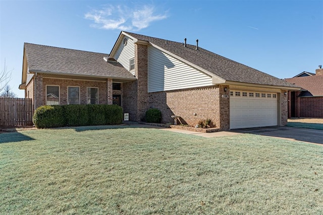 view of front of home with a garage and a front yard