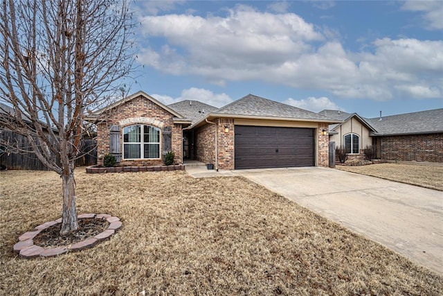 ranch-style home featuring a garage and a front yard