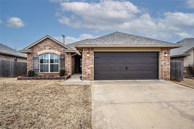 ranch-style home with a garage and a front yard