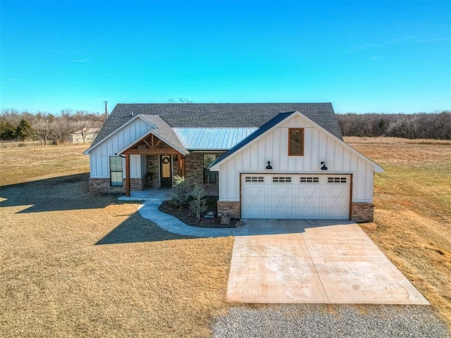 view of front of house with a garage and a front lawn