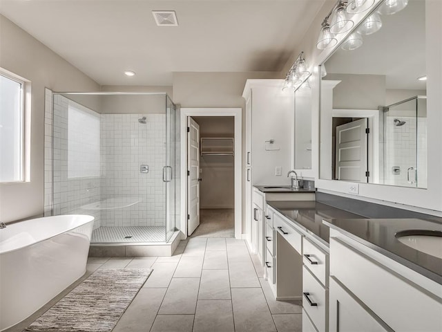 bathroom with vanity, separate shower and tub, and tile patterned floors