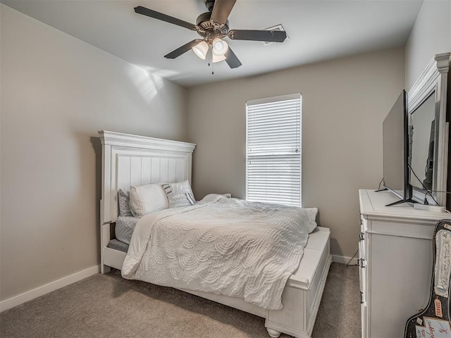 carpeted bedroom with baseboards and ceiling fan