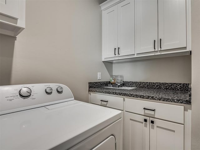 laundry room with washer / clothes dryer and cabinet space