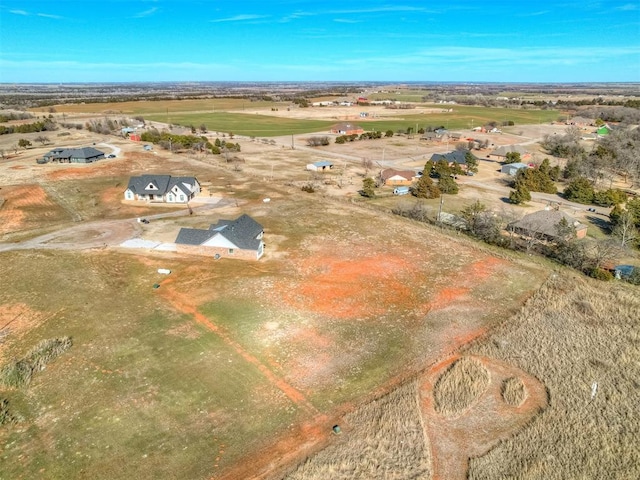 birds eye view of property with a rural view