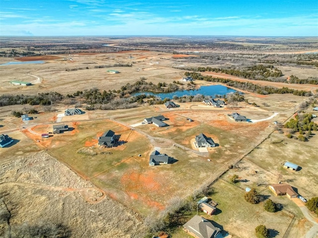 aerial view with a water view and a rural view