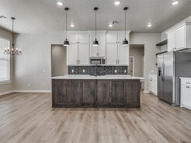 19001 Bobcat Ridge Ct, Cashion, OK 73016 - kitchen featuring stainless steel appliances, light countertops, decorative backsplash, baseboards, and recessed lighting