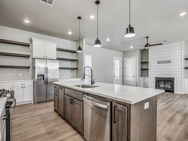 19001 Bobcat Ridge Ct, Cashion, OK 73016 - kitchen featuring open shelves, stainless steel appliances, a sink, ceiling fan, and recessed lighting