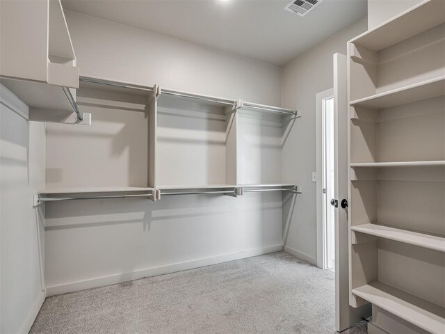 19001 Bobcat Ridge Ct, Cashion, OK 73016 - walk in closet featuring carpet floors