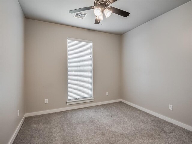 19001 Bobcat Ridge Ct, Cashion, OK 73016 - empty room with ceiling fan, carpet floors, and plenty of natural light