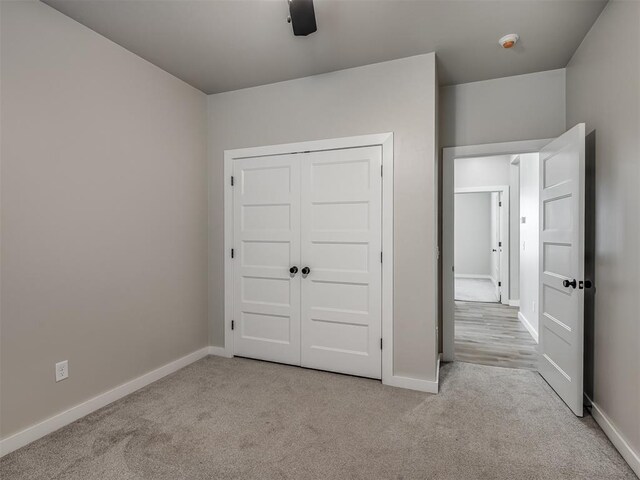 19001 Bobcat Ridge Ct, Cashion, OK 73016 - unfurnished bedroom featuring carpet flooring, baseboards, and a closet