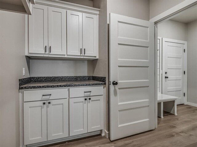 19001 Bobcat Ridge Ct, Cashion, OK 73016 - laundry room with light wood-style flooring