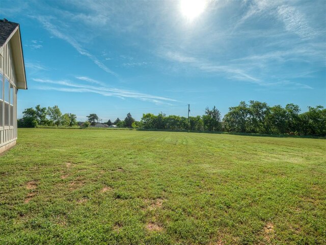 19001 Bobcat Ridge Ct, Cashion, OK 73016 - view of green lawn with a rural view
