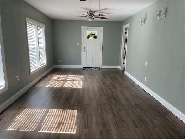 foyer featuring ceiling fan and dark hardwood / wood-style flooring