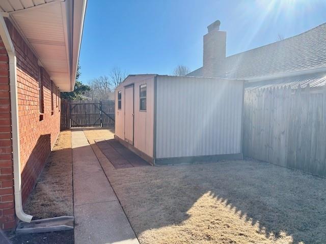 view of property exterior with a shed