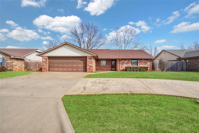 single story home with a garage and a front lawn