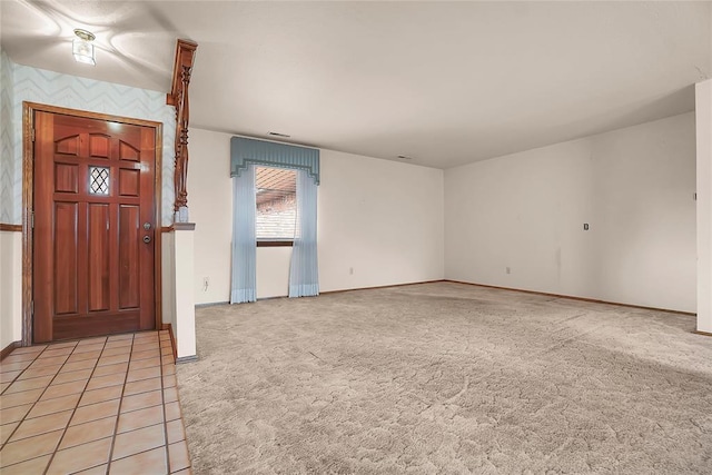 entrance foyer featuring light carpet