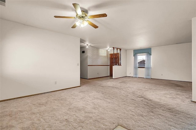 unfurnished room with ceiling fan and carpet floors