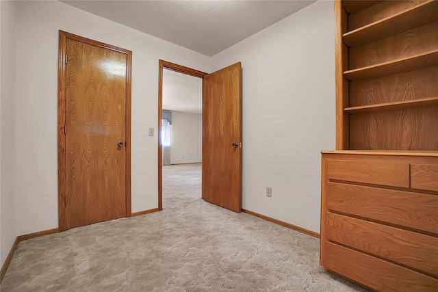 unfurnished bedroom featuring light colored carpet